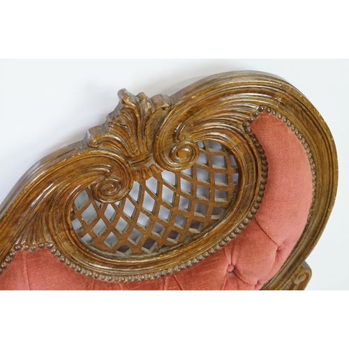 583 - 20th century continental style settee with shaped elaborately pierced back, the button back and seat... 