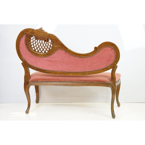 583 - 20th century continental style settee with shaped elaborately pierced back, the button back and seat... 