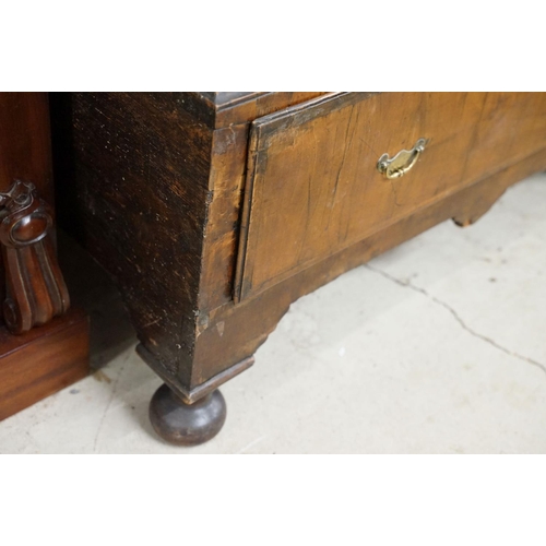 585 - Early 18th century walnut chest of two short over four long drawers on stand, with later bun feet, 9... 