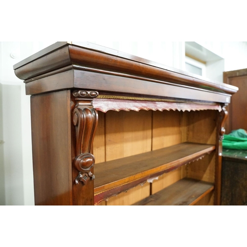 586 - Mahogany bookcase of five shelves, with cut leather gilt embossed fringes, 180cm high x 135cm wide x... 