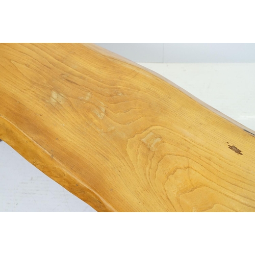 595 - Polished plank bench of rustic form with x-shaped supports, 37.5cm high x 117cm wide x 37cm deep