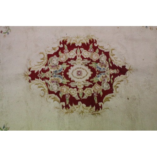 574A - Large red ground wool floor rug with floral decoration, fringe to either end, measures approx 260cm ... 