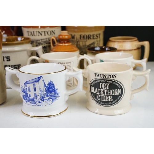 102 - Collection of cider bottles and mugs to include the Taunton cider company, Matthew Clarke, Coombes c... 