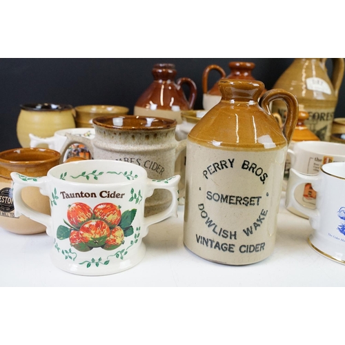 102 - Collection of cider bottles and mugs to include the Taunton cider company, Matthew Clarke, Coombes c... 