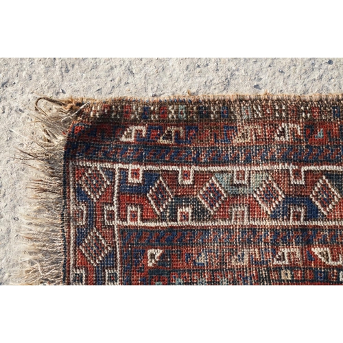 578A - Middle Eastern red ground wool Rug decorated with two guls, 150cm x 118cm