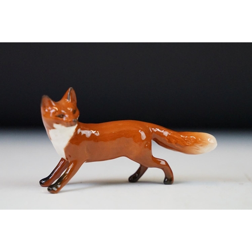 91 - Collection of ceramic ornaments to include two Beswick labradores, fox and a calf, a Royal Doulton a... 