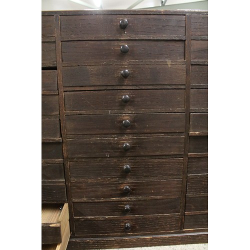 557 - Collectors cabinet, an arrangement of thirty drawers, 52cm high x 77cm wide x 32cm deep