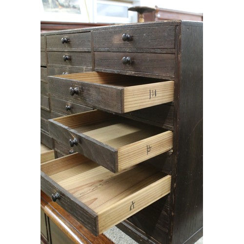 557 - Collectors cabinet, an arrangement of thirty drawers, 52cm high x 77cm wide x 32cm deep