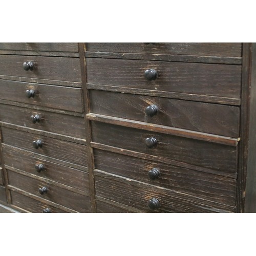 557 - Collectors cabinet, an arrangement of thirty drawers, 52cm high x 77cm wide x 32cm deep