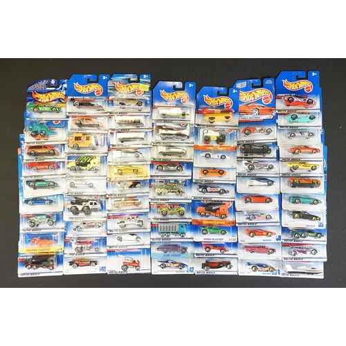 1015 - Around 69 carded Mattel Hot Wheels diecast models, appearing vg and some ex