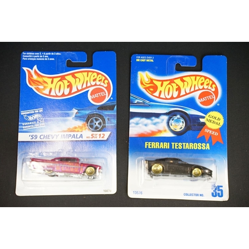 1015 - Around 69 carded Mattel Hot Wheels diecast models, appearing vg and some ex