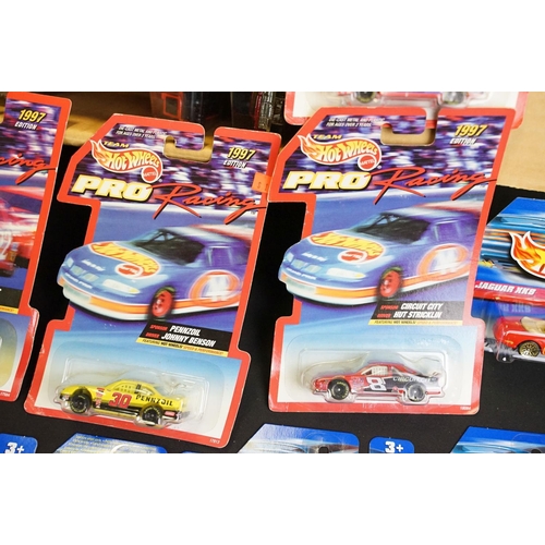 1017 - Around 84 carded Mattel Hot Wheels diecast models featuring Pro Racing 1997 Editions, appearing vg a... 