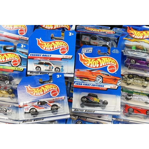 1031 - Around 130 carded Mattel Hot Wheels diecast models, appearing vg and some ex