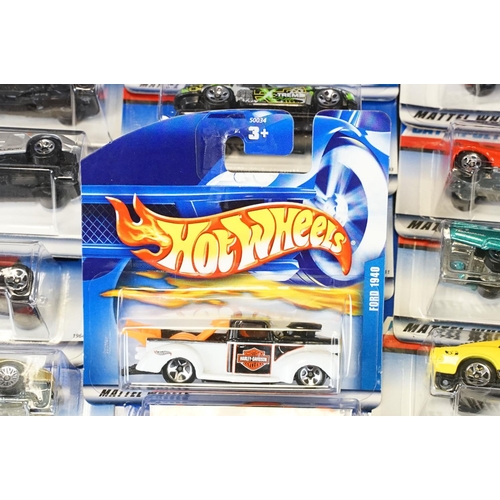 1031 - Around 130 carded Mattel Hot Wheels diecast models, appearing vg and some ex