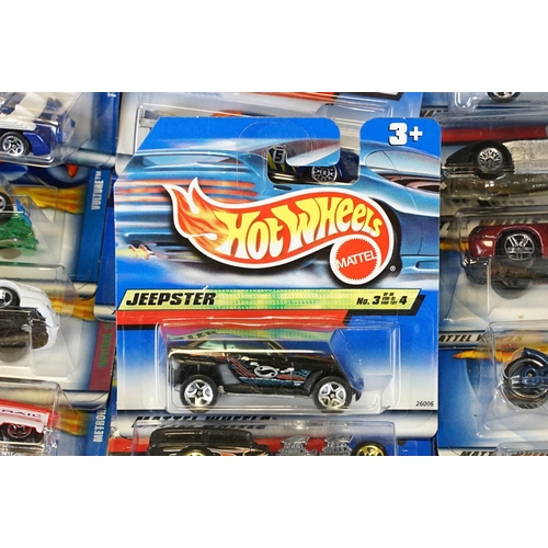 1031 - Around 130 carded Mattel Hot Wheels diecast models, appearing vg and some ex