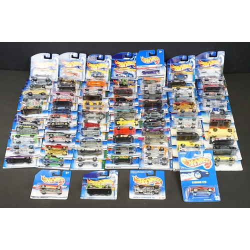 1034 - Around 80 carded Mattel Hot Wheels diecast models, appearing vg and some ex