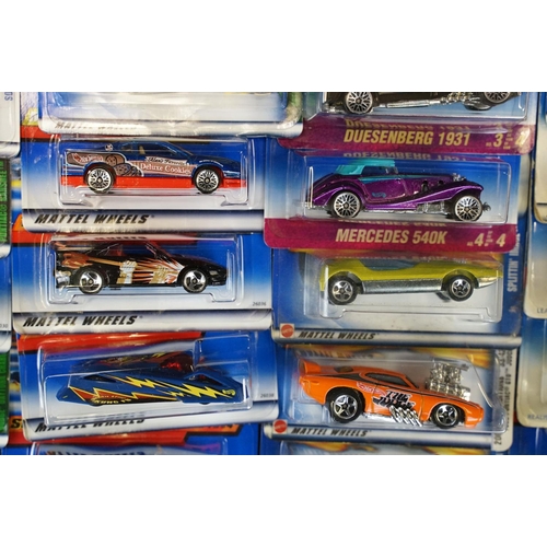 1034 - Around 80 carded Mattel Hot Wheels diecast models, appearing vg and some ex