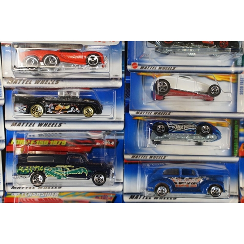 1034 - Around 80 carded Mattel Hot Wheels diecast models, appearing vg and some ex