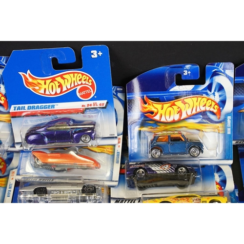 1034 - Around 80 carded Mattel Hot Wheels diecast models, appearing vg and some ex