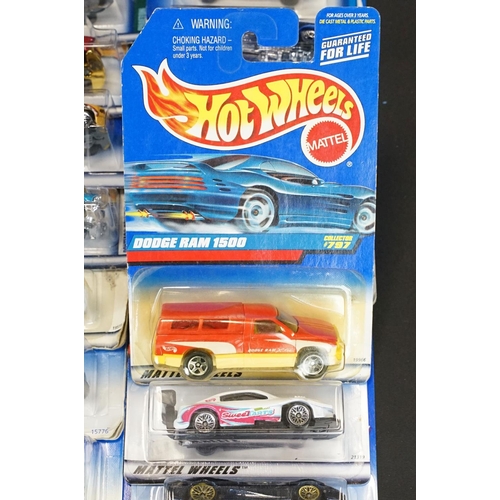 1034 - Around 80 carded Mattel Hot Wheels diecast models, appearing vg and some ex