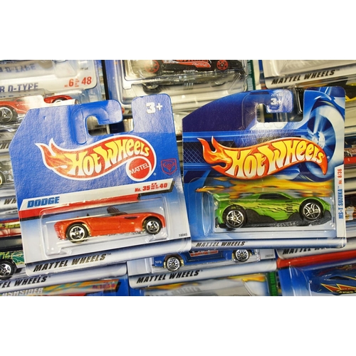 1034 - Around 80 carded Mattel Hot Wheels diecast models, appearing vg and some ex