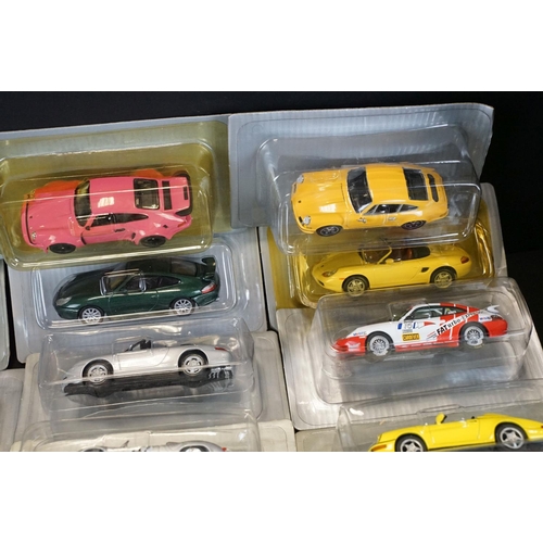 1051 - Collection of 50 1/43 scale boxed / cased DeAgostini Porsche diecast models, in clear cases and card... 