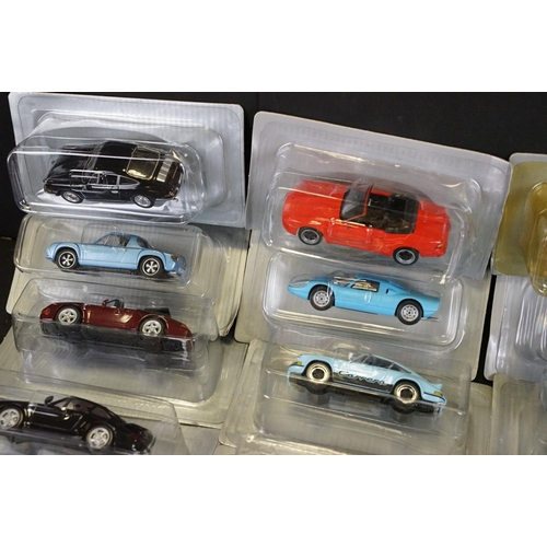 1051 - Collection of 50 1/43 scale boxed / cased DeAgostini Porsche diecast models, in clear cases and card... 