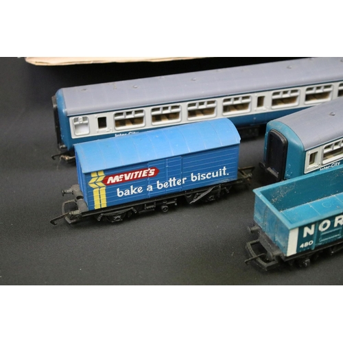 192 - 68 OO gauge items of rolling stock, mainly Hornby & Triang examples featuring tankers, wagons, vans ... 