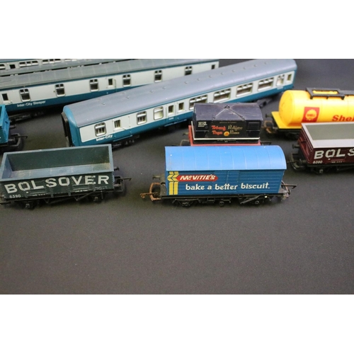 192 - 68 OO gauge items of rolling stock, mainly Hornby & Triang examples featuring tankers, wagons, vans ... 
