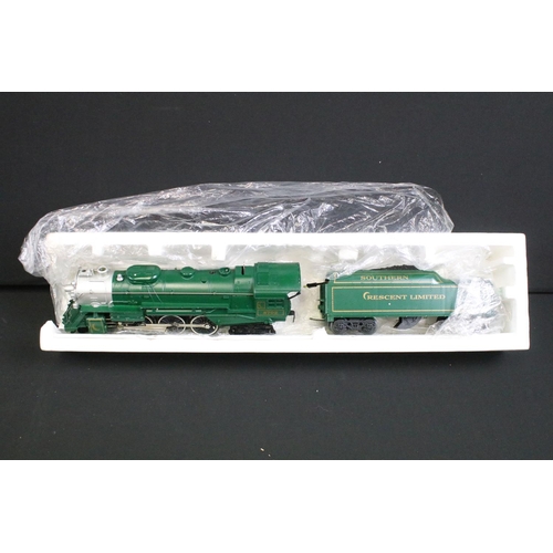 130 - Two boxed Lionel O gauge locomotives to include 6-8702 Southern Crescent 4-6-4 Steam Locomotive and ... 