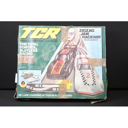 311 - Boxed TCR Slotless Race System with 1 x cased Scalextric Jaguar XKRS (play worn), 5 x Scalextric slo... 