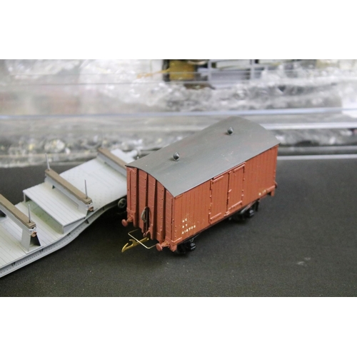 234 - Over 100 OO gauge items of rolling stock, mainly kit built examples featuring coaches, wagons and va... 