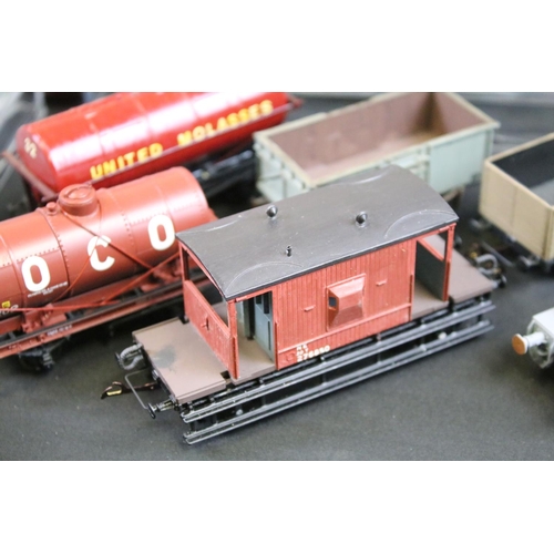 234 - Over 100 OO gauge items of rolling stock, mainly kit built examples featuring coaches, wagons and va... 