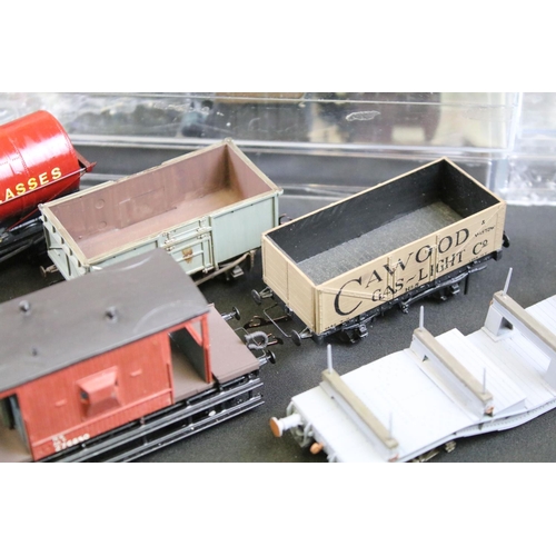 234 - Over 100 OO gauge items of rolling stock, mainly kit built examples featuring coaches, wagons and va... 