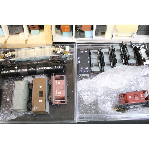 234 - Over 100 OO gauge items of rolling stock, mainly kit built examples featuring coaches, wagons and va... 