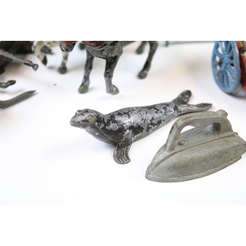 254 - Collection of Britains farming metal animals and farming accessories to include wagons, horses, cows... 