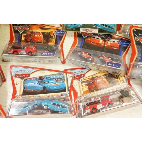 1165 - 20 Carded Mattel Disney Pixar Cars diecast twin pack models to include The World of Cars, all ex, co... 