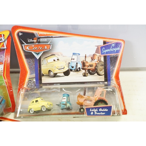 1165 - 20 Carded Mattel Disney Pixar Cars diecast twin pack models to include The World of Cars, all ex, co... 