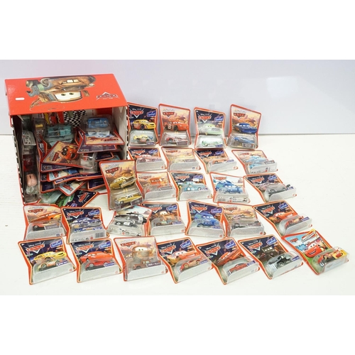 1166 - 57 Carded Mattel Disney Pixar Cars diecast models, all ex, contained within a Cars storage box.