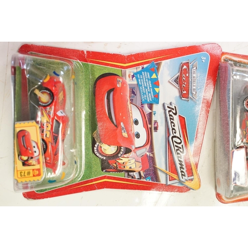 1166 - 57 Carded Mattel Disney Pixar Cars diecast models, all ex, contained within a Cars storage box.