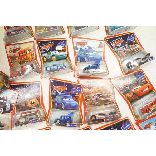 1166 - 57 Carded Mattel Disney Pixar Cars diecast models, all ex, contained within a Cars storage box.