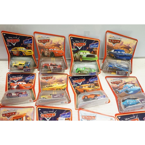 1166 - 57 Carded Mattel Disney Pixar Cars diecast models, all ex, contained within a Cars storage box.