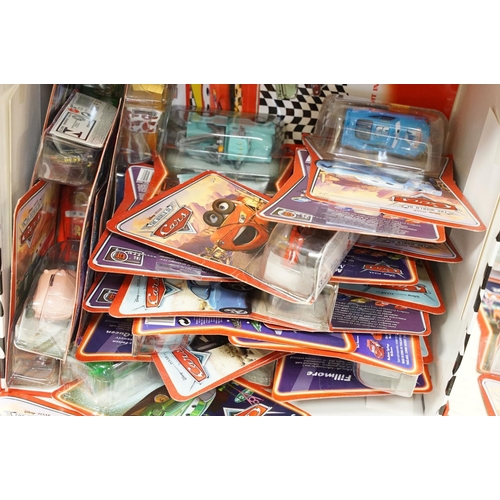 1166 - 57 Carded Mattel Disney Pixar Cars diecast models, all ex, contained within a Cars storage box.