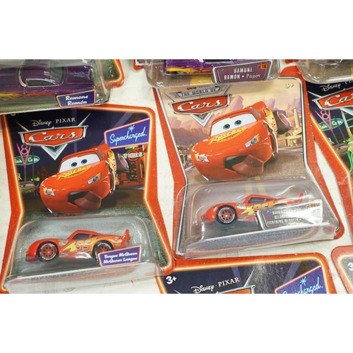 1167 - 57 Carded Mattel Disney Pixar Cars diecast models, all ex, contained within a Cars storage box