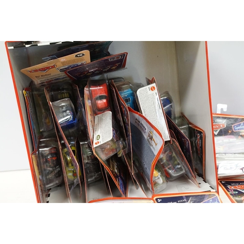 1167 - 57 Carded Mattel Disney Pixar Cars diecast models, all ex, contained within a Cars storage box