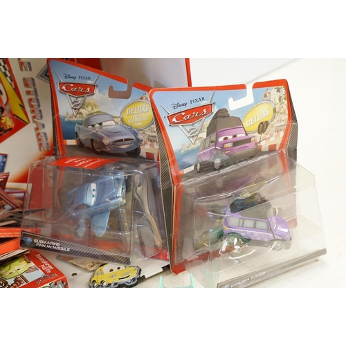 1168 - Collection of Disney Pixar Cars items to include 3 x boxed deluxe diecast models, 3 x Radiator Sprin... 