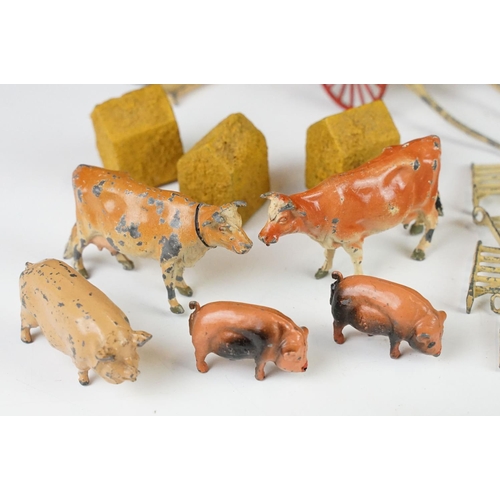 244 - Small quantity of various Britains farming metal animals and farming accessories to include pigs, co... 