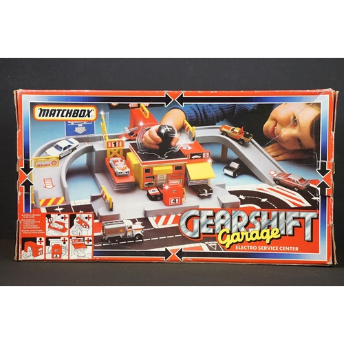 278 - Collection of four boxed toys and games to include Matchbox Gearshift Garage Electro Service Center,... 