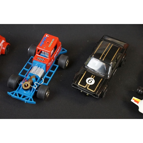 279 - Collection of various slot cars and racing games to include Scalextric cars featuring red Mini, Rove... 