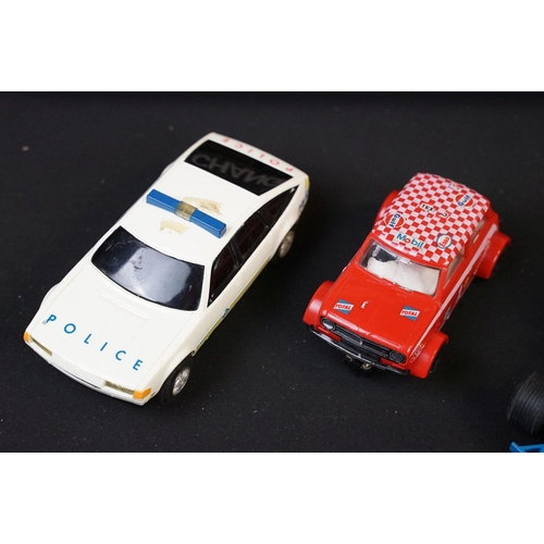 279 - Collection of various slot cars and racing games to include Scalextric cars featuring red Mini, Rove... 